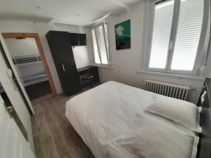 Postel nebo postele na pokoji v ubytování Hotel Au Spatial