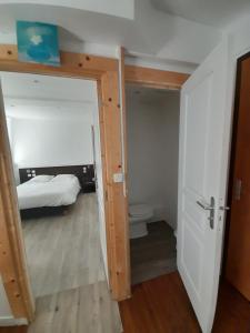 Postel nebo postele na pokoji v ubytování Hotel Au Spatial