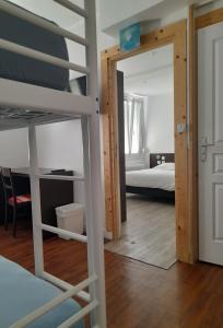 Postel nebo postele na pokoji v ubytování Hotel Au Spatial