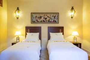 Postel nebo postele na pokoji v ubytování Riad Magda & Spa