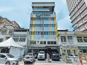 a building with a sign on the top of it at Capital O 90841 New One Enigma Hotel in Kuala Lumpur