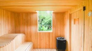 a room with a sauna with a window in it at Villa El Cielo Ishigaki in Ishigaki Island