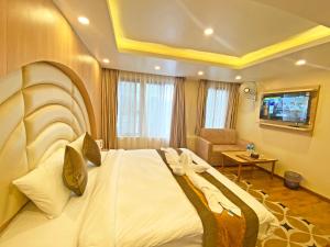 Letto o letti in una camera di Hotel Airport Gurkha