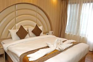 Letto o letti in una camera di Hotel Airport Gurkha