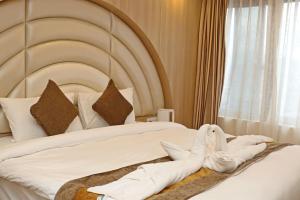 Letto o letti in una camera di Hotel Airport Gurkha