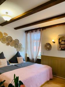 a bedroom with two beds and a window at Hotel Restaurant Syrtaki in Gernsbach