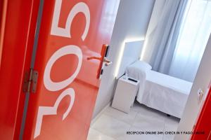 Postel nebo postele na pokoji v ubytování Hotel DL Port