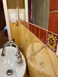 a bathroom with a sink and a mirror at Hlinená izba na Hájiku in Banská Štiavnica +13 photos