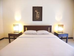 Katil atau katil-katil dalam bilik di Margo Utomo Hill View Resort