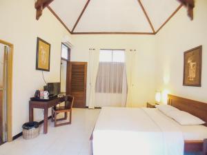 Katil atau katil-katil dalam bilik di Margo Utomo Hill View Resort