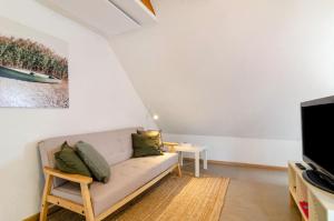 TV a/nebo společenská místnost v ubytování Ferienwohnung Marienstraße