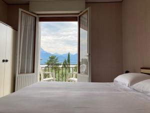 Postel nebo postele na pokoji v ubytování Hotel Zanetti