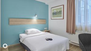 Postel nebo postele na pokoji v ubytování Center Hotels Plaza