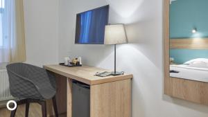 TV a/nebo společenská místnost v ubytování Center Hotels Plaza