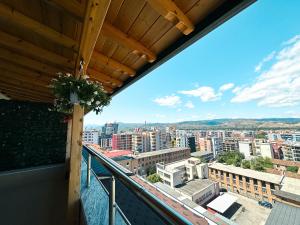 a balcony with a view of a city at Cozy Elegance Above Korca in Korçë