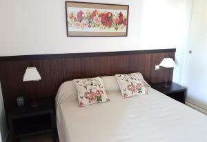 a bedroom with a bed with two pillows on it at Apartment in La Cala de Mijas in La Cala de Mijas +20 photos