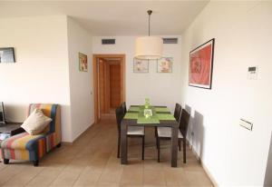 a dining room with a table and a chair at Apartment in La Cala de Mijas in La Cala de Mijas