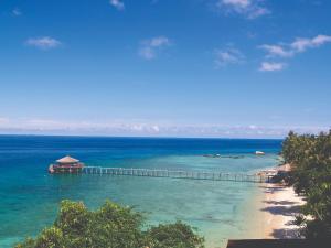 a view of a beach with a pier in the water at Japamala Resort by Samadhi - Adults Only in Tioman Island
