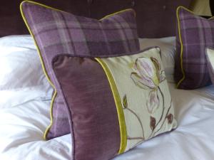 A bed or beds in a room at Manor House Farm 