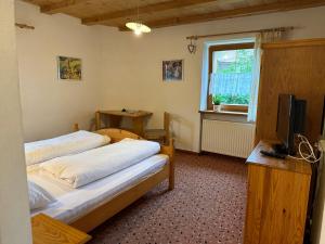 Postel nebo postele na pokoji v ubytování Haus Santner