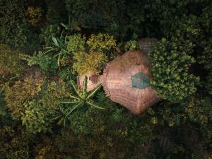 an overhead view of a house in a forest at Inigtan Lio Bamboo Cottages in El Nido