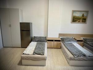 Łóżko lub łóżka w pokoju w obiekcie Hostel Sportowa
