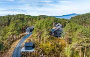 an aerial view of a house on a hill with a road at Nice Home In Valevg With Sauna And 2 Bedrooms in Valevåg