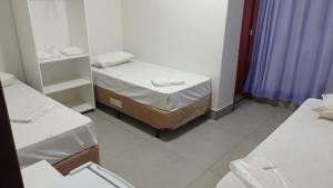 Ένα ή περισσότερα κρεβάτια σε δωμάτιο στο Hotel Marina Torrano