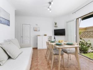 a white living room with a table and a couch at Casa Marcelo, charming and renovated house in Antigua