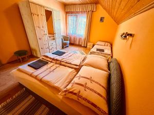 a bedroom with a large bed in a room at Emília Apartment in Balatonföldvár
