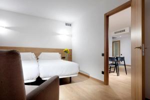 Posteľ alebo postele v izbe v ubytovaní Apartaments SB Corona Tortosa