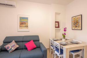 a living room with a couch and a table at Bed E-bike in Ancona