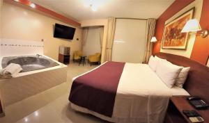 A bed or beds in a room at HOTEL Javier Prado Inn
