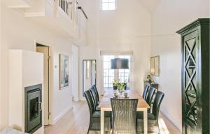 a dining room with a table and chairs at Beach Front Apartment In Bagenkop With Kitchen in Bagenkop