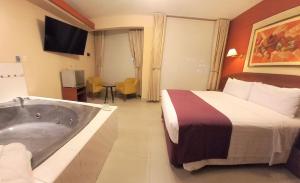 A bed or beds in a room at HOTEL Javier Prado Inn