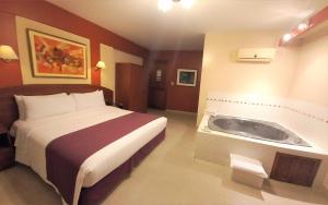 A bed or beds in a room at HOTEL Javier Prado Inn