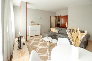a living room with a couch and a table at LAR DA REVOLTA in Cedeira