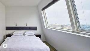 Postel nebo postele na pokoji v ubytování Center Hotels Plaza