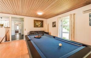 a living room with a pool table in it at Beautiful Home In Vig With 4 Bedrooms, Sauna And Wifi in Vig