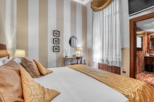Posteľ alebo postele v izbe v ubytovaní Spagna Dream Suites