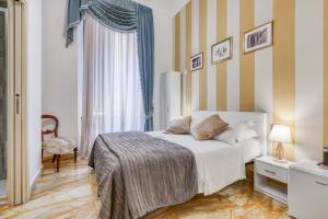 Posteľ alebo postele v izbe v ubytovaní Spagna Dream Suites