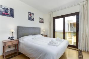 Ένα ή περισσότερα κρεβάτια σε δωμάτιο στο Marina Del Castillo 2076