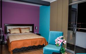 Postel nebo postele na pokoji v ubytování Plaza Sur Hotel & Suites