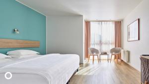 Postel nebo postele na pokoji v ubytování Center Hotels Plaza