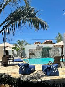 a swimming pool with blue inflatables in a resort at Nautillus Hotel in Parnaíba