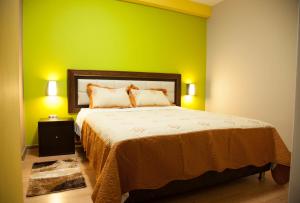 Postel nebo postele na pokoji v ubytování Plaza Sur Hotel & Suites
