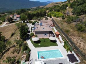 an aerial view of a house with a swimming pool at TorrediLuna - MoonTower 