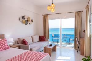 a living room with a couch and a view of the ocean at Star Beach apartment in Kastrí