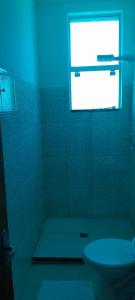 a bathroom with a toilet and a blue light at Central Palace Hotel in Fortaleza +88 photos