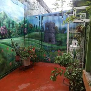 a mural of a teddy bear on a wall at HOSTAL VALDIVIA in Valdivia